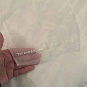 Fingerless gloves that say “to love and to cherish” and “to have and to hold”